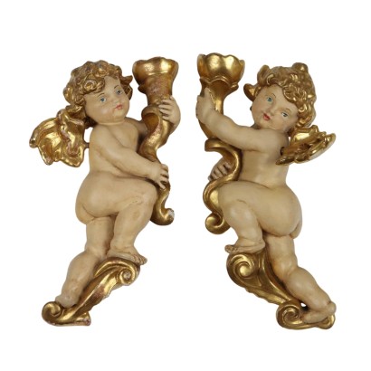 Coppia di Putti in Legno Intagliato