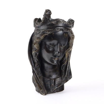 Rostro femenino en bronce